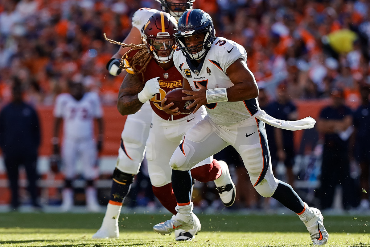 Washington Commanders defensive end Chase Young chasing down Denver Broncos quarterback Russell Wilson.